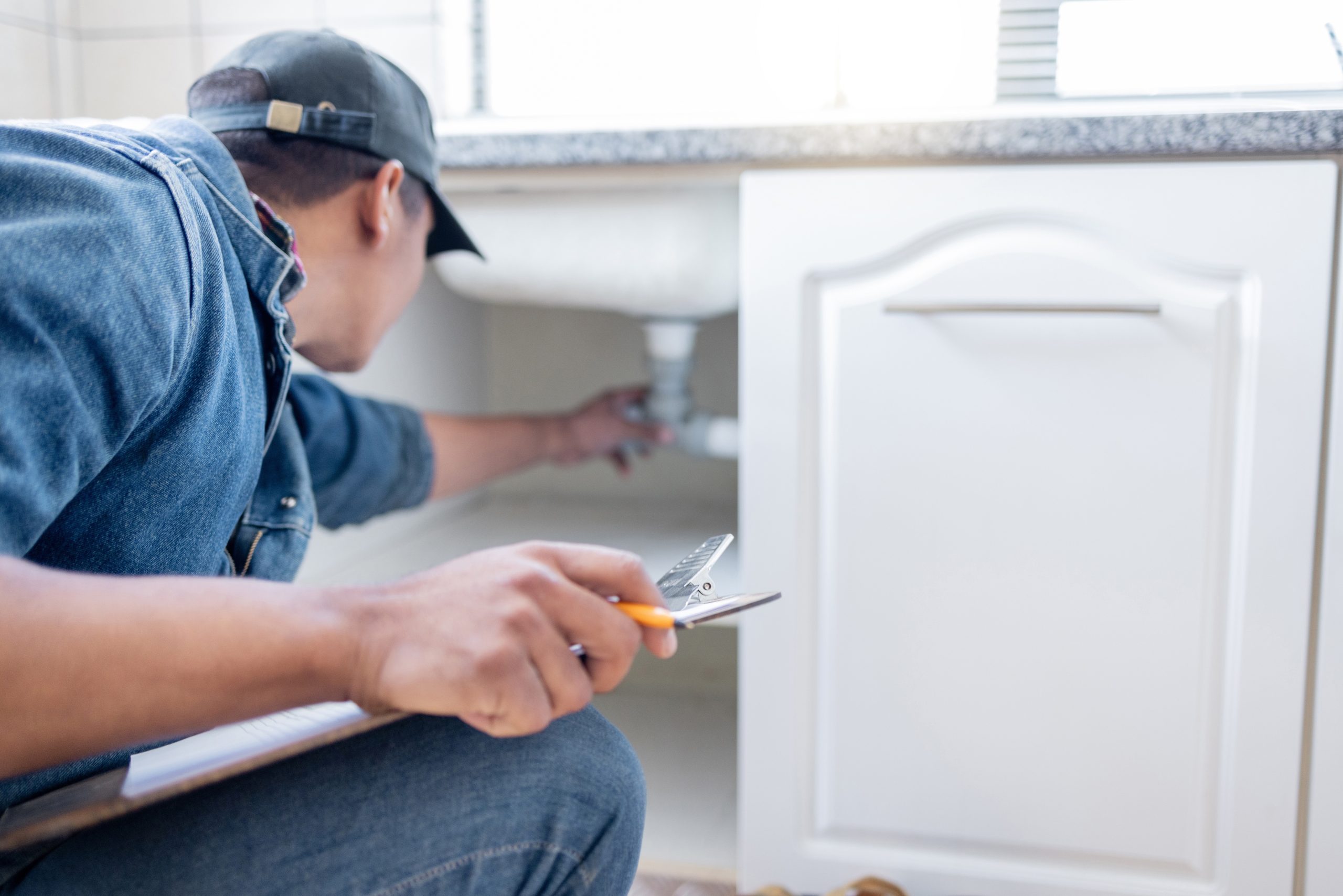 Plumber man, technician and clipboard document for pipeline, home renovation and quality assurance notes. Handyman, plumbing service and checklist in house for building, engineering and inspection.